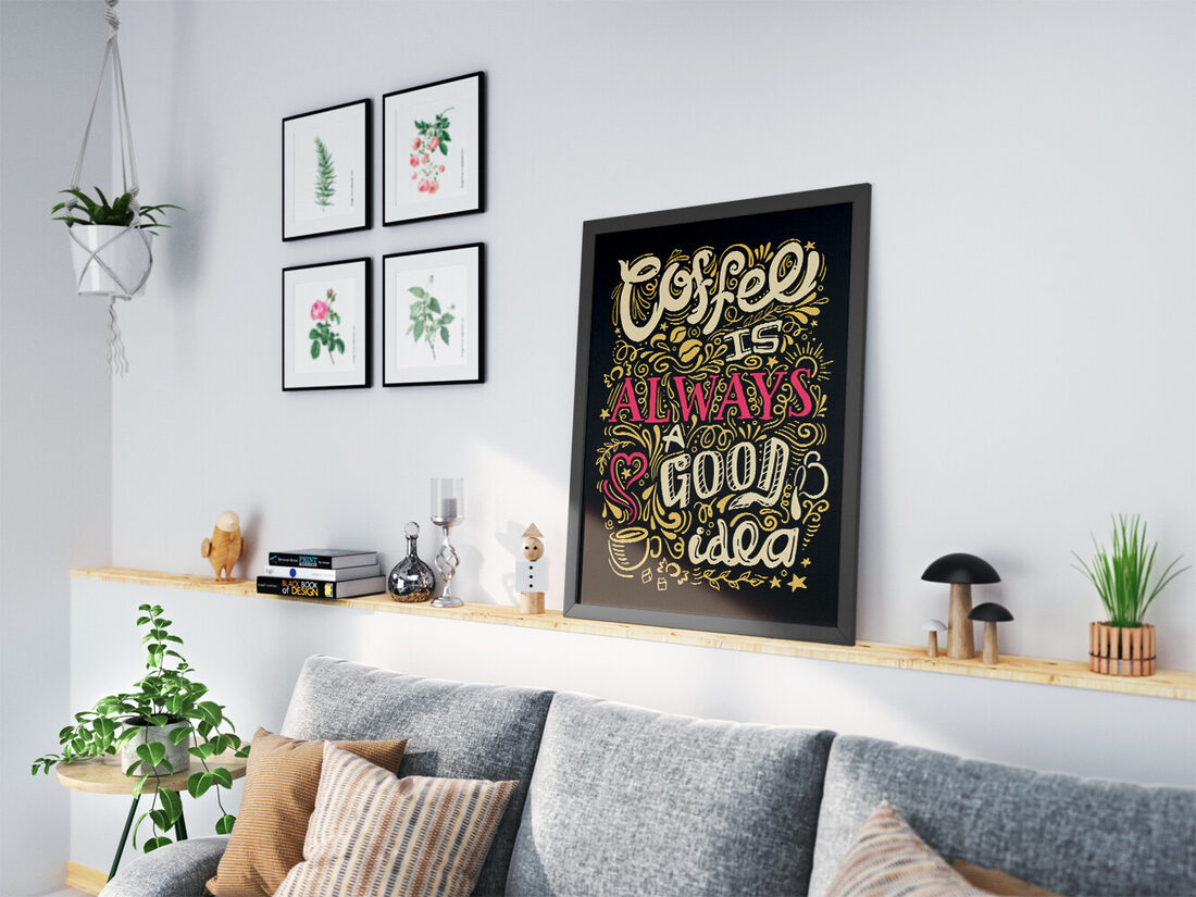 Decorative hand-lettered art print on a dark background featuring the quote 'Coffee is ALWAYS a GOOD idea' in cream, pink, and gold with coffee beans,